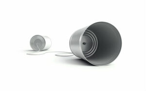 Two cans linked with string depicting communication