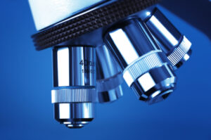 Microscope detail against blue background