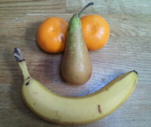 Smiley face made up of fruit