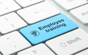 Employee training key on keyboard
