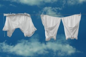 Old fashioned underwear on a clothes line under a blue sky