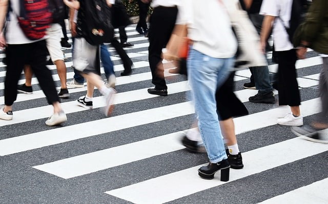 People walking on a busy zebra crossing for returning to work: anxiety management and agoraphobia training course