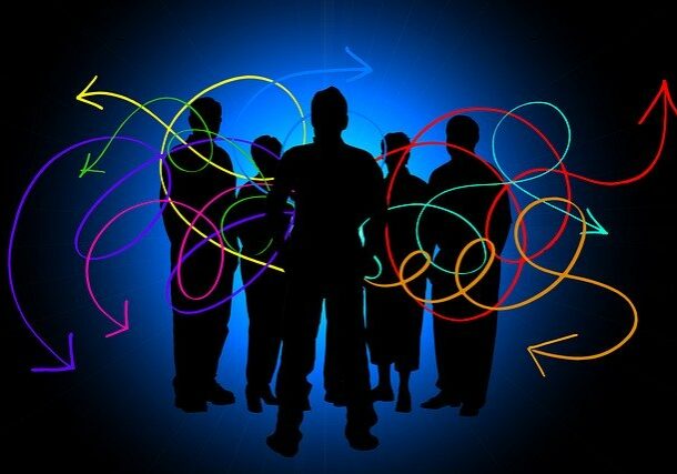 Silhouettes of a group of people with colourful feedback arrows all around them